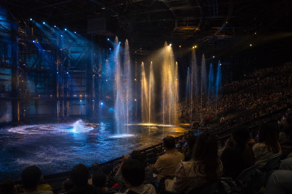 Water fountain effects rising over the stage during an aquatic performance