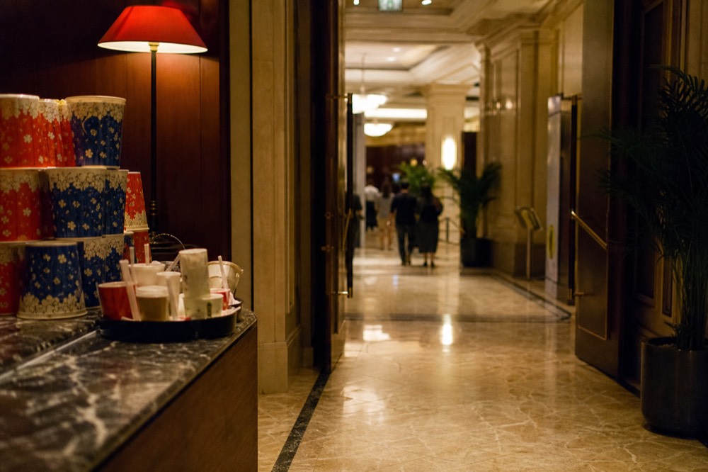 A theatre foyer with a concession counter and warm lighting before a show