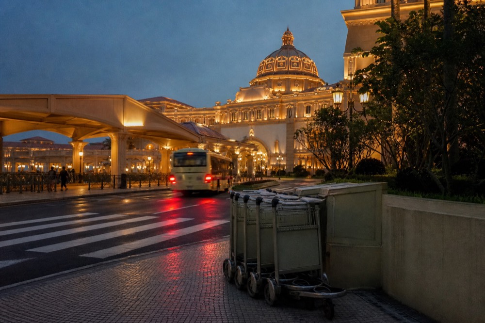 Cotai resort facades and walkways lit up in the evening